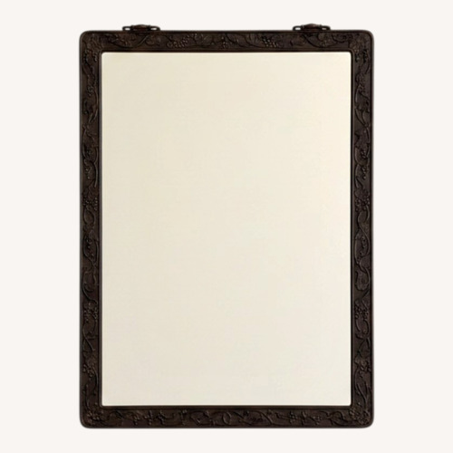Used Black Wood Mirror W Relief Frame Design for sale on AptDeco
