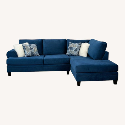 Used Blue 2 Piece Sectional Sofa and Ottoman  for sale on AptDeco