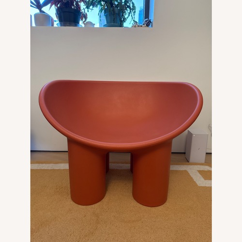 Used Orange Polyurethane Accent Chair for sale on AptDeco
