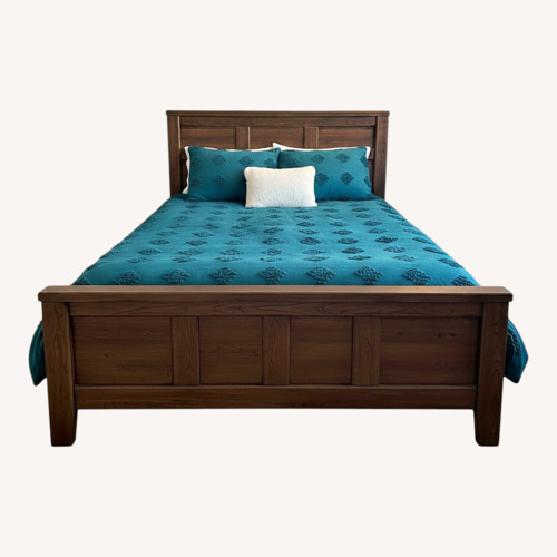 Used Ashley Furniture Dark Brown Wood Queen Bed for sale on AptDeco