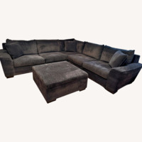 Living Spaces Dark Gray Sectional and Ottoman