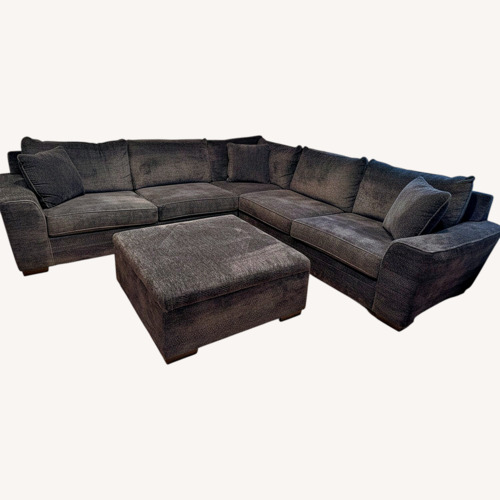 Used Living Spaces Dark Gray Sectional and Ottoman for sale on AptDeco