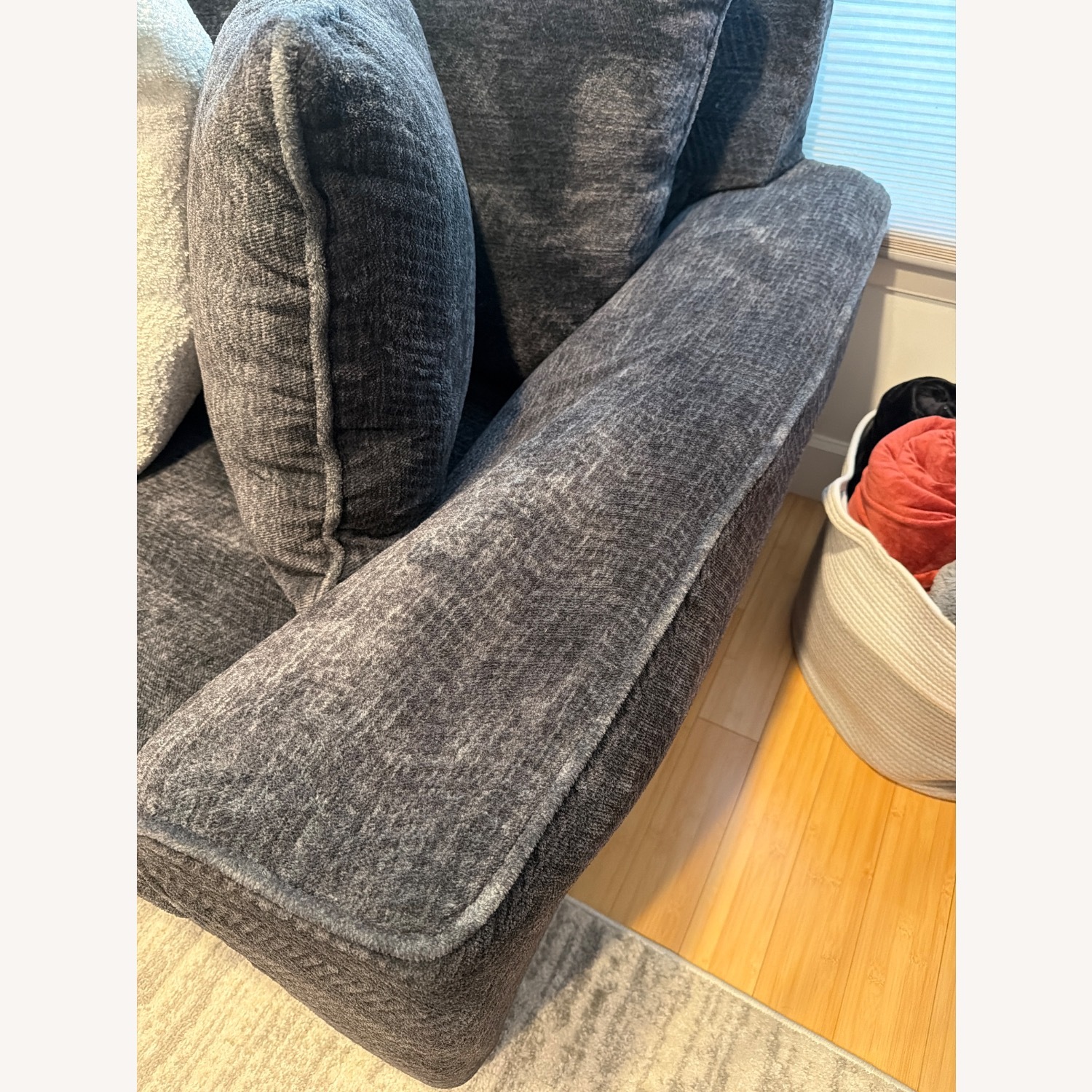 Living Spaces Dark Gray Sectional and Ottoman - image-2