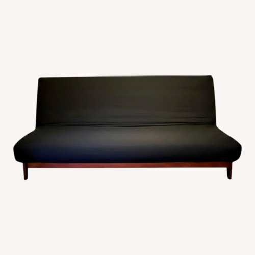 Used Strata Furniture Black Wood Futon for sale on AptDeco