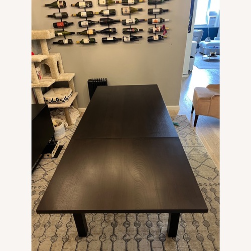 Used IKEA Extendable Dark Brown Wood Dining Table for sale on AptDeco