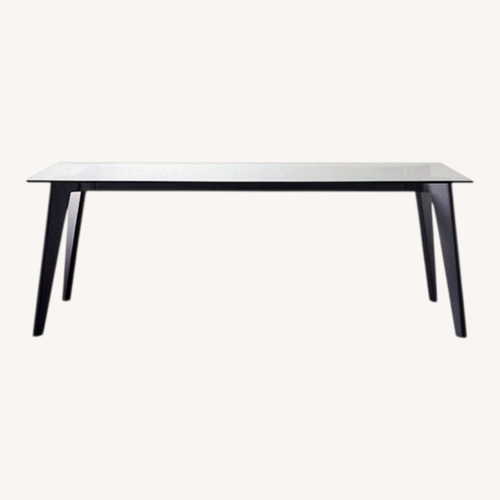 Used CB2 Harper Black Dining Table with Glass Top for sale on AptDeco