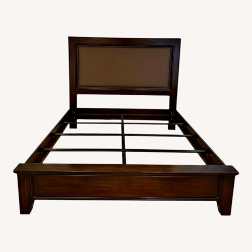 Used Ashley Furniture Dark Brown Wood King Bed for sale on AptDeco