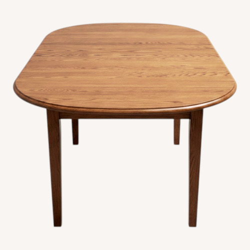Used Light Brown Wood Dining Table for sale on AptDeco
