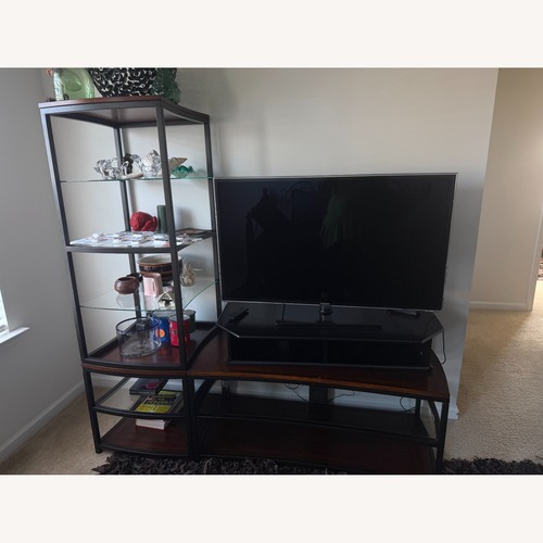 Used Dark Brown Glass Wall Unit for sale on AptDeco