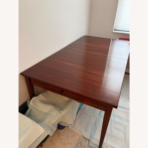 Used Brown Street Furniture Wood Dining Table for sale on AptDeco