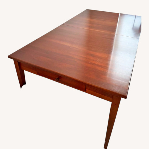 Used Brown Street Furniture Wood Dining Table for sale on AptDeco