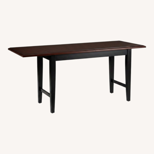 Used Pier 1 Imports Dark Brown Wood Dining Table for sale on AptDeco