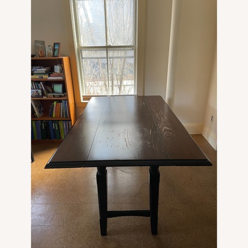 Used Pier 1 Imports Dark Brown Wood Dining Table for sale on AptDeco