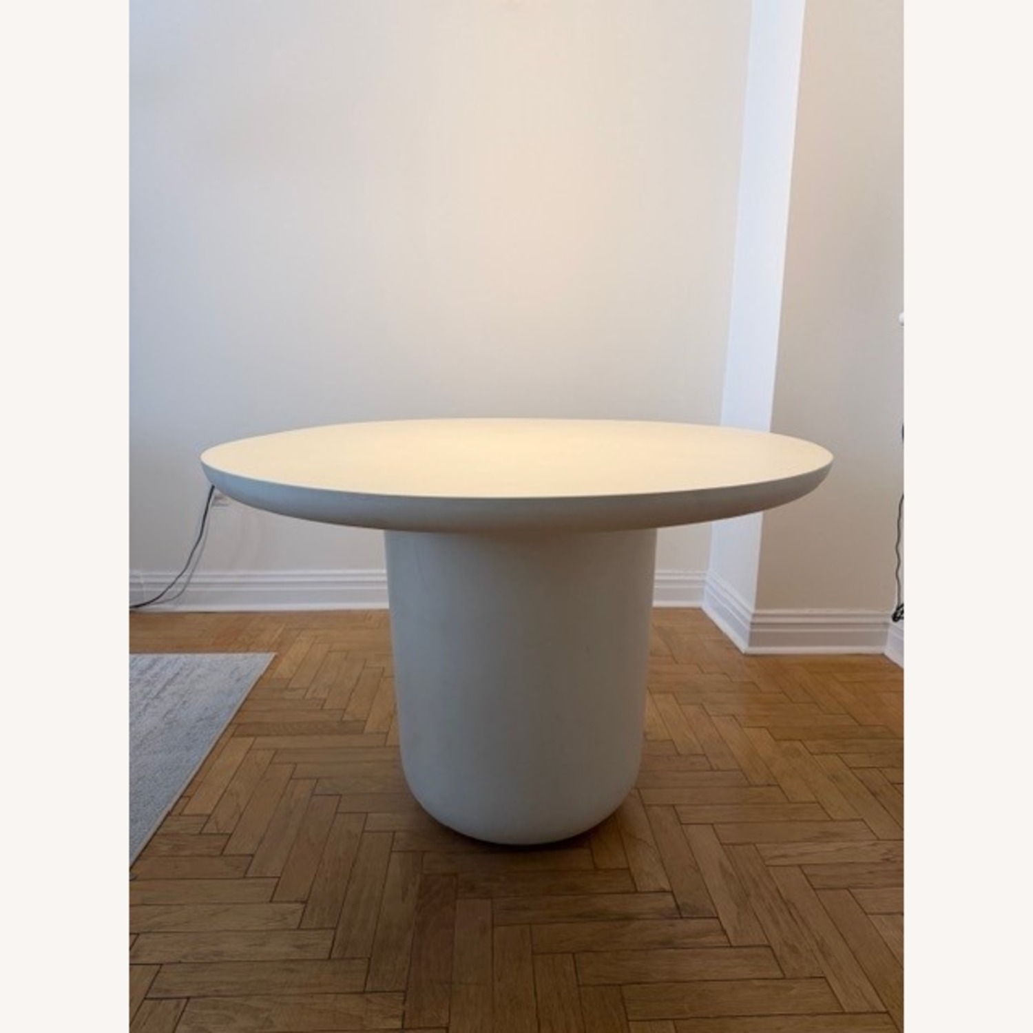 CB2 Lola 45" Round Ivory Concrete Dining Table - image-1