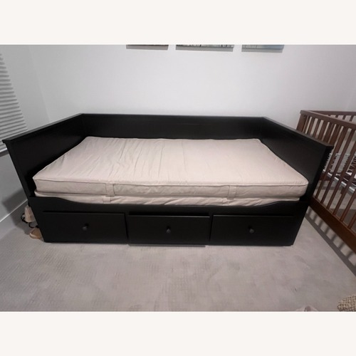 Used IKEA Hemnes Series Dark Brown Wood Daybed for sale on AptDeco