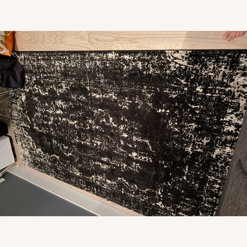 Used Vintage Persian Rug in Black/Ecru for sale on AptDeco