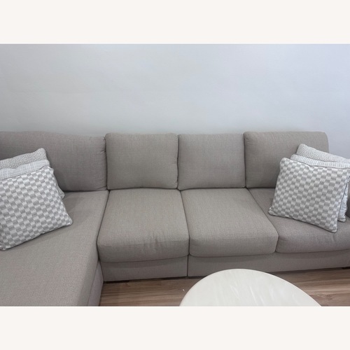 Used Ashley Larce Natural 3+ Piece Sectional for sale on AptDeco