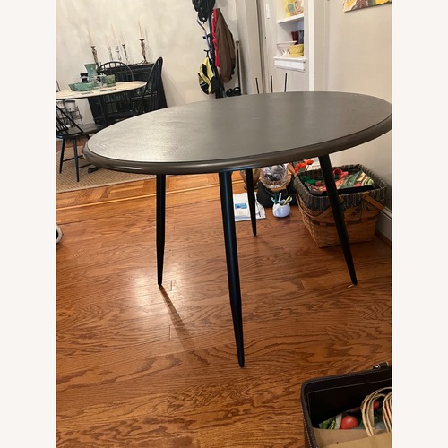 Used Black Metal Dining Table for sale on AptDeco