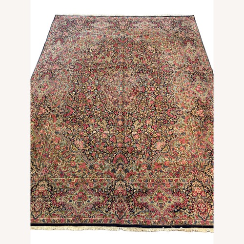 Used Floral Pink Wool Area Rug 9.10' x 13' for sale on AptDeco