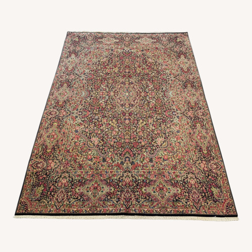 Used Floral Pink Wool Area Rug 9.10' x 13' for sale on AptDeco