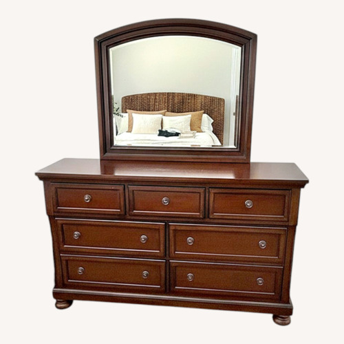 Used Dark Cherry 7-Drawer Dresser with Mirror for sale on AptDeco