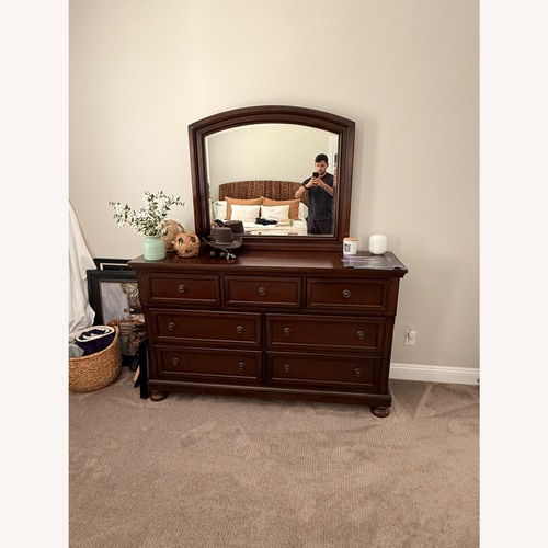 Used Dark Cherry 7-Drawer Dresser with Mirror for sale on AptDeco