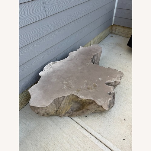 Used Arhaus Natural Stone Root Coffee Table for sale on AptDeco