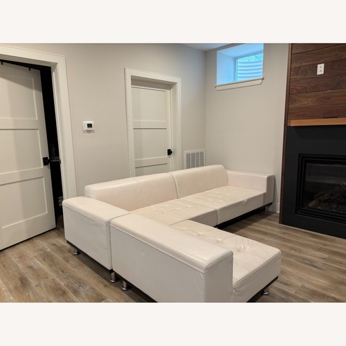 Used White leather sectional for sale on AptDeco