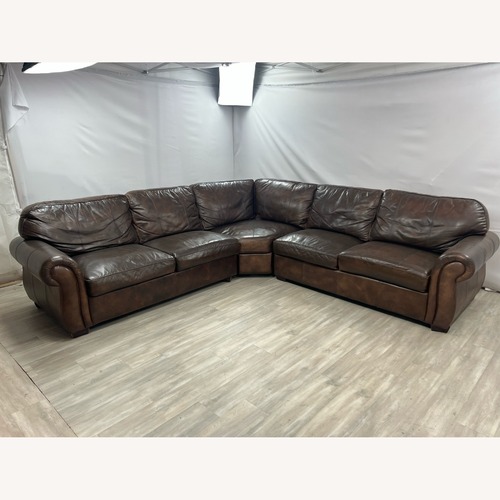 Used Raymour & Flanigan Dark Brown Leather Sectional for sale on AptDeco