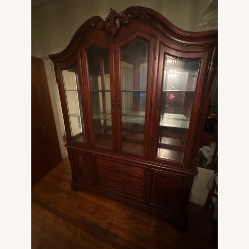 Used Vintage/Antique Dark Brown Wood Armoire for sale on AptDeco