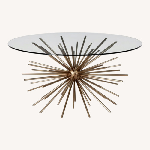 Used West Elm Kids Starburst Gold Glass Coffee Table for sale on AptDeco