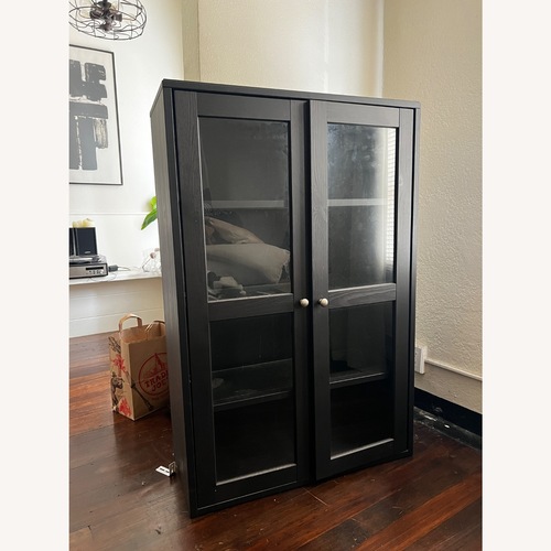 Used IKEA Dark Brown Wood Glass Cabinet for sale on AptDeco