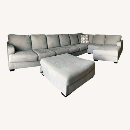 Used Ashley Furniture Dark Gray 7 Piece Sectional for sale on AptDeco