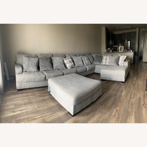 Used Ashley Furniture Dark Gray 7 Piece Sectional for sale on AptDeco