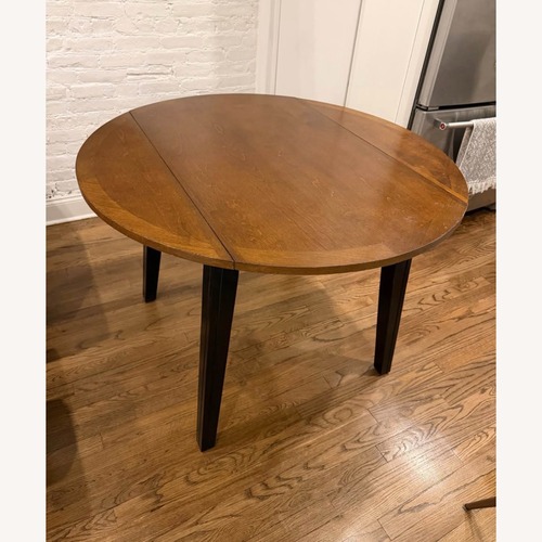 Used Vintage/Antique Dark Brown Dining Table for sale on AptDeco