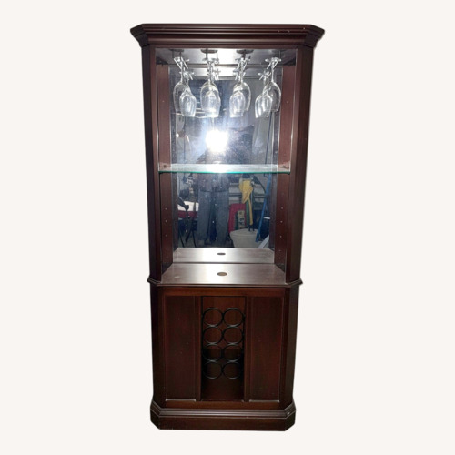 Used Howard Miller Hardwood Bar/Wine Cabinet for sale on AptDeco