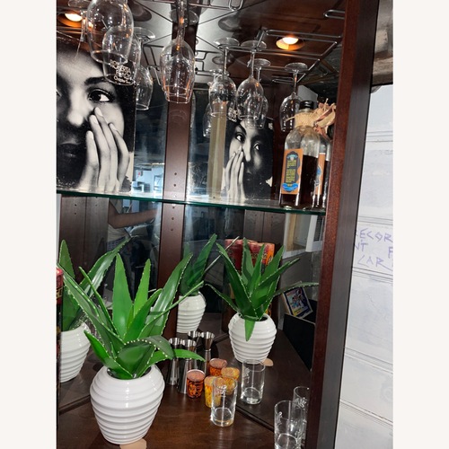 Used Howard Miller Hardwood Bar/Wine Cabinet for sale on AptDeco