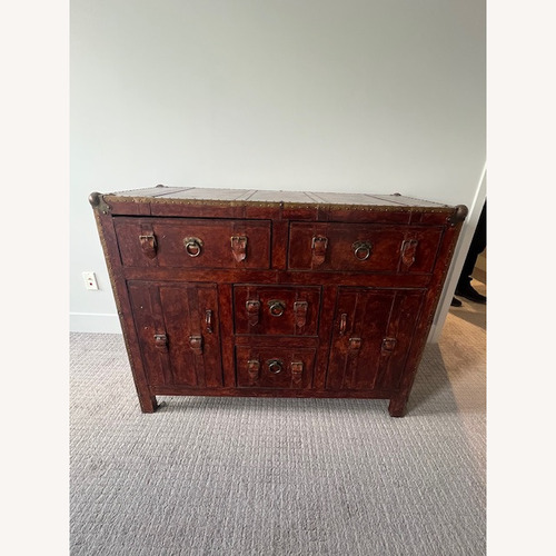 Used Vintage/Antique Red Leather Dresser with Buckles for sale on AptDeco