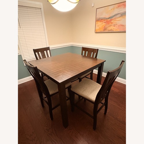 Used Dark Brown Wood Dining Set for sale on AptDeco