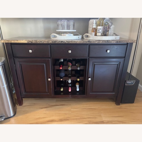 Used Raymour & Flanigan Dark Brown Wood Armoire for sale on AptDeco