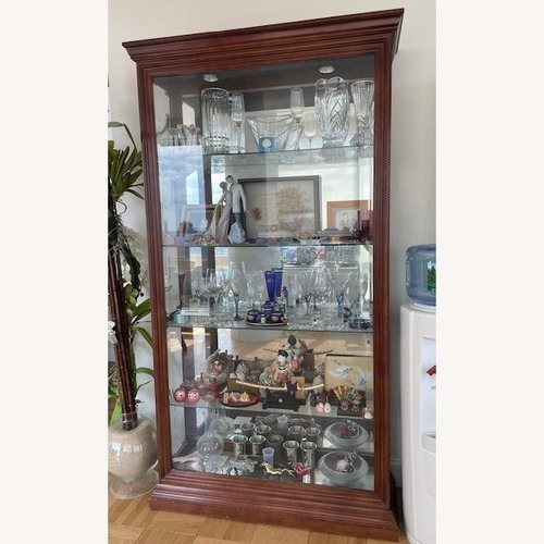 Used Macy's Mahogany Glass Curio  for sale on AptDeco