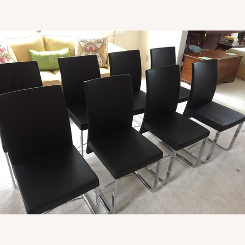 Used Roche Bobois Black Leather Dining Chairs for sale on AptDeco
