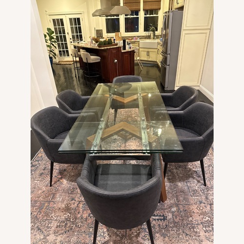 Used Dark Gray Glass Dining Set for sale on AptDeco