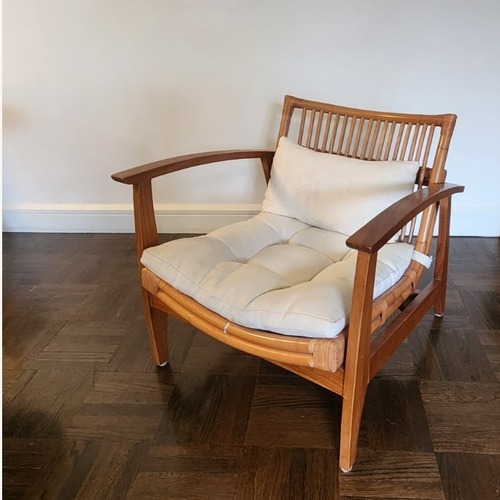 Used CB2 Noelie Rattan Lounge Chair with White Cushion for sale on AptDeco