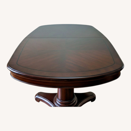 Used Dark Brown Wood Dining Table with 6 Chairs for sale on AptDeco
