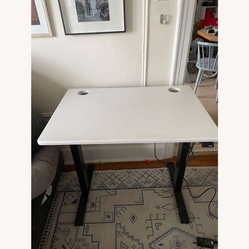 Used Black and White Motorized Standing Desk for sale on AptDeco