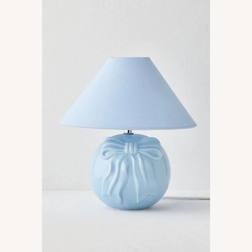 Used Urban Outfitters Bow Blue Ceramic Table Lamp for sale on AptDeco