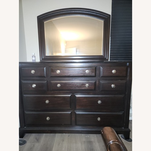 Used Ridgley Dark Brown Wood Dresser With Mirror for sale on AptDeco