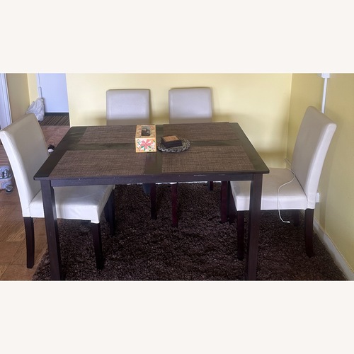 Used Dark Brown Wood Dining Set for sale on AptDeco