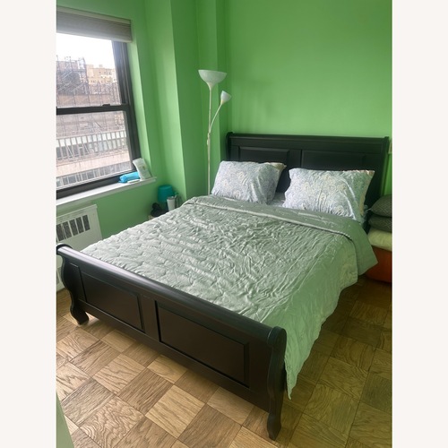 Used IKEA HASSELVIKA Dark Brown Wood Queen Bed for sale on AptDeco